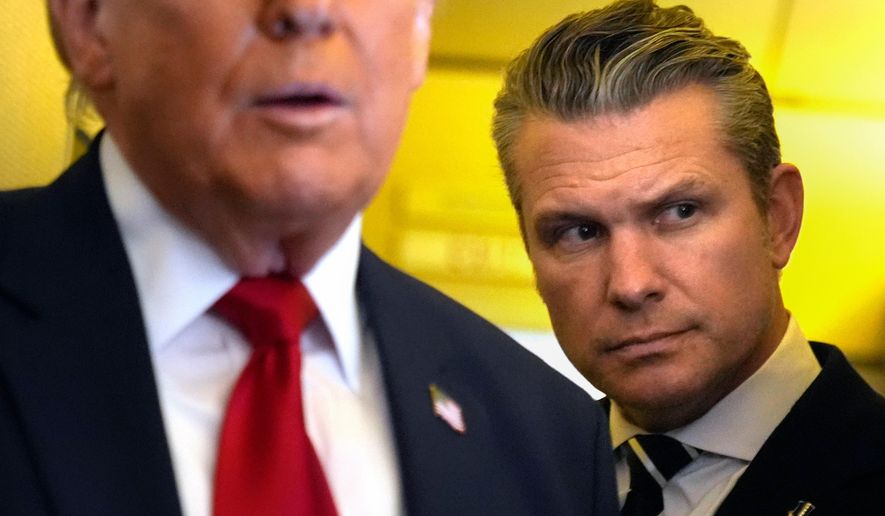 Defense Secretary Pete Hegseth listens as President Donald Trump speaks to reporters while traveling aboard Air Force One en route from Dover Air Force Base, Del., to Miami, Saturday, March 7, 2026. (AP Photo/Mark Schiefelbein)