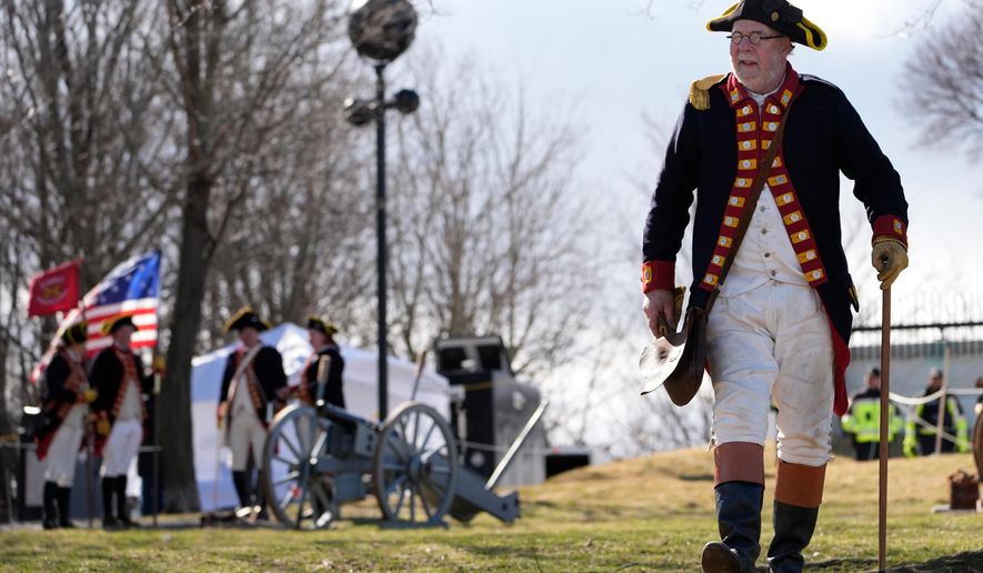 Crane's Continental Artillery reenactor Jeffrey Cooke takes part in an Evacuation Day ceremony marking the 1776 departure of British troops from the city during the American Revolutionary War, Tuesday, March 17, 2026, in Boston. (AP Photo/Robert F. Bukaty)
