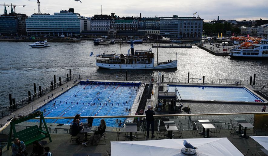 Outdoor swimming pools are seen in a harbor of Helsinki, May 29, 2023. (AP Photo/Pavel Golovkin, File)
