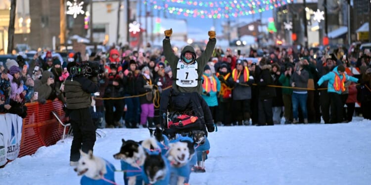 Former reality TV star Jessie Holmes repeats as champion of the grueling Iditarod sled dog race