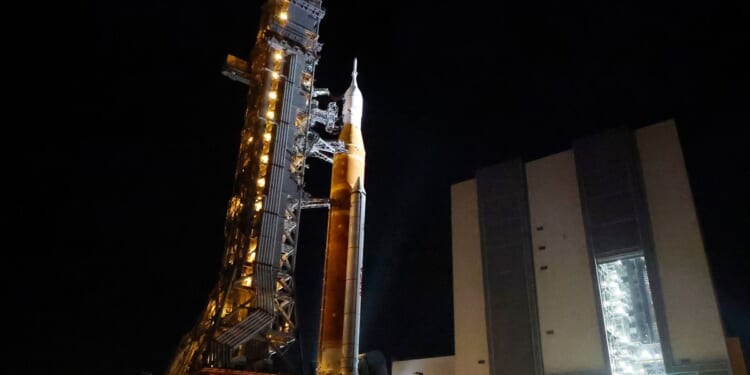 NASA hauls its repaired moon rocket from the hangar back to the pad for an early April launch