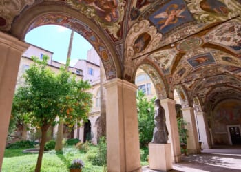A hidden cloister in the center of Rome has a turbulent past etched on its walls