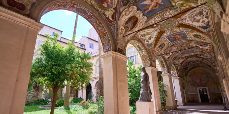 A hidden cloister in the center of Rome has a turbulent past etched on its walls