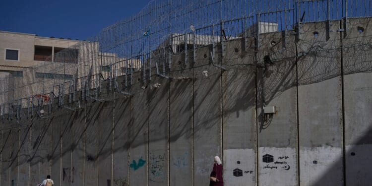 Israeli settlers smash cars and set fires in attacks on Palestinians in the West Bank