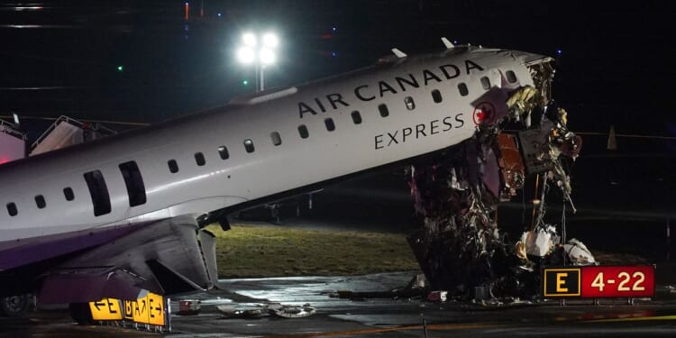 Pilot and copilot killed in collision between jet and fire truck at New York’s LaGuardia Airport