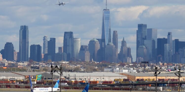 A burning smell forces Newark airport control tower evacuation, briefly halting flights