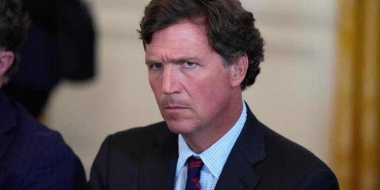 Tucker Carlson calls for U.S. to share power with communist China