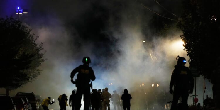 Appeals court pauses orders restricting federal officers’ use of tear gas at Portland ICE building
