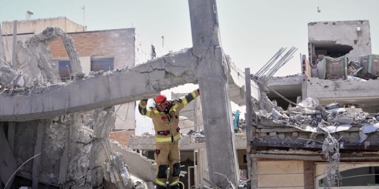 Israel hits Tehran with wave of strikes and warns attacks on Iran ‘will escalate and expand’