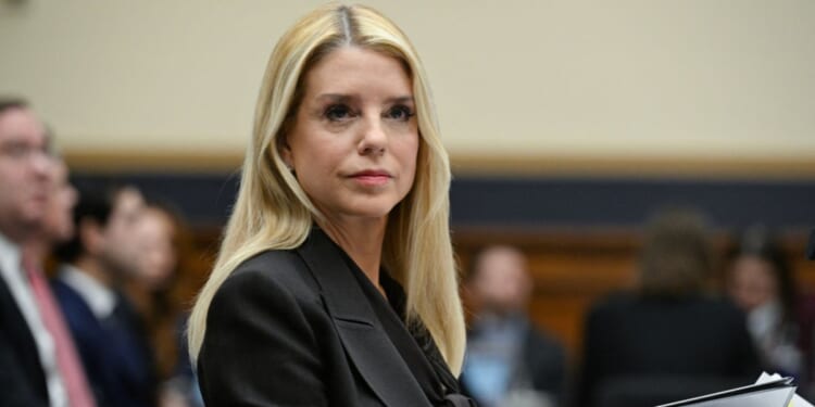 Attorney General Pam Bondi takes her seat before testifying before a House Judiciary Committee hearing on "Oversight of the Department of Justice" on Capitol Hill in Washington, D.C., on Feb. 11, 2026.