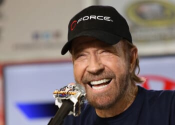 Actor Chuck Norris speaks with the media during a press conference prior to the NASCAR Sprint Cup Series AAA Texas 500 at Texas Motor Speedway on Nov. 6, 2016, in Fort Worth, Texas.