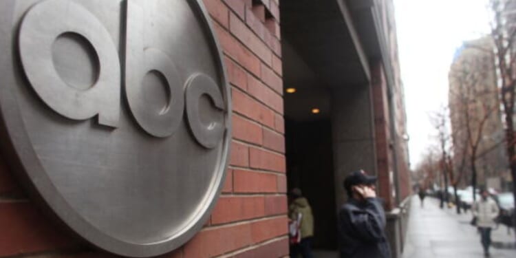 People walk by the ABC Headquarters in Atlanta, Georgia, on Feb. 24, 2010