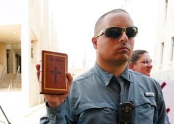 The Supreme Court ruled unanimously in favor of Christian street preacher Gabriel Olivier, seen holding a Bible during a 2022 anti-abortion protest at Hinds County Chancery Court in Jackson, Mississippi.