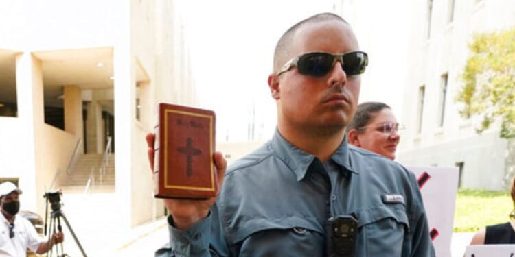 The Supreme Court ruled unanimously in favor of Christian street preacher Gabriel Olivier, seen holding a Bible during a 2022 anti-abortion protest at Hinds County Chancery Court in Jackson, Mississippi.