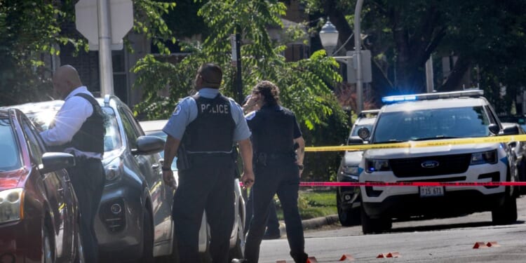 Police investigate the scene of a drive-by shooting on July 6, 2024, in Chicago, Illinois.