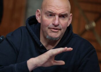 Sen. John Fetterman, a Pennsylvania Democrat, prepares to vote to advance Sen. Markwayne Mullin, an Oklahoma Republican, to be Secretary of the Department of Homeland Security. Democrats were so angry at Fetterman's vote with the Republicans that some called for him to be replaced.