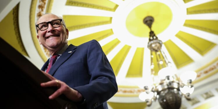 Sen. Minority Leader Chuck Schumer (D-NY) smiles at podium as he speaks to the press on Jan. 13, 2026.