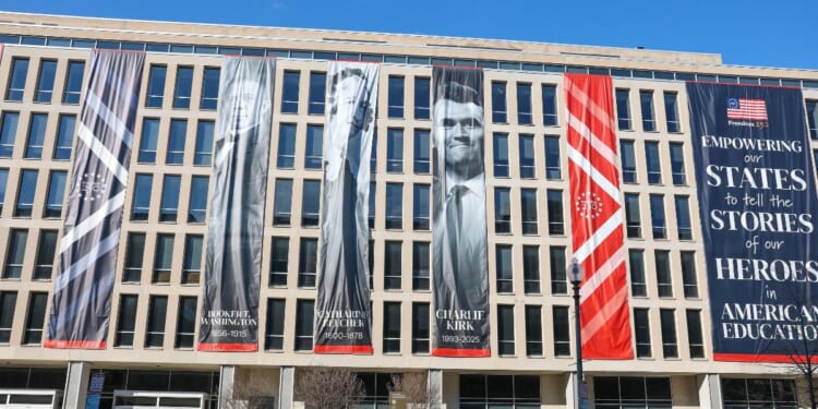 A banner with Charlie Kirk's image is seen on the outside of the Department of Education headquarters on March 1, 2026, in Washington, D.C.