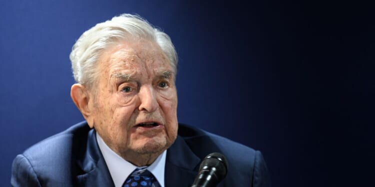 Hungarian-born U.S. investor and philanthropist George Soros answers to questions after delivering a speech on the sidelines of the World Economic Forum annual meeting in Davos on May 24, 2022.