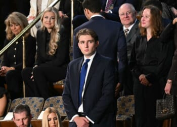 Barron Trump, son of President Donald Trump, stands before the arrival of President Trump for the State of the Union address in the House Chamber of the U.S. Capitol in Washington, D.C., on Feb. 24, 2026.