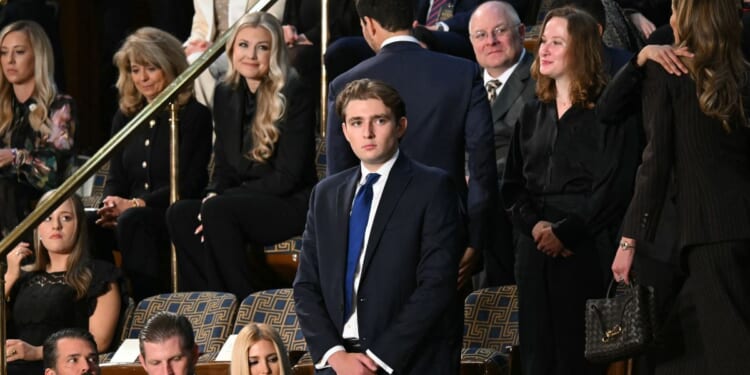 Barron Trump, son of President Donald Trump, stands before the arrival of President Trump for the State of the Union address in the House Chamber of the U.S. Capitol in Washington, D.C., on Feb. 24, 2026.