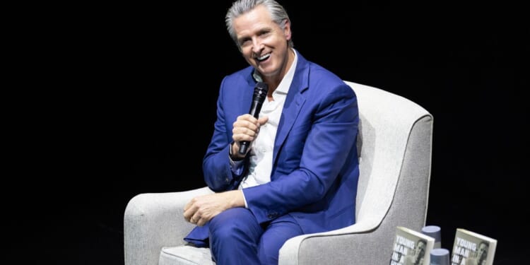 California Governor Gavin Newsom sits for an interview at an event promoting his book "Young Man in a Hurry" on Feb. 28, 2026 in San Francisco.