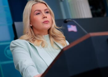 Karoline Leavitt stands at the podium as she gives press briefing on March 25, 2026.