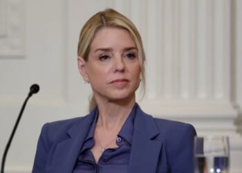 Attorney General Pam Bondi listens as President Donald Trump speaks during a lunch with the Trump Kennedy Center Board Members in the East Room of the White House on March 16, 2026, in Washington, D.C.