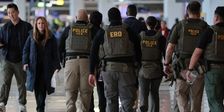 Immigration and Customs Enforcement agents patrol Terminal B at LaGuardia Airport on March 23, 2026, in New York City.