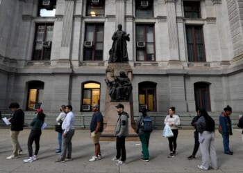 Philadelphia residents wait in a line around city hall to cast their ballot on the last day of early voting on Oct. 29, 2024, in Philadelphia, Pennsylvania.