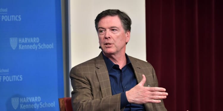 Former FBI Director James Comey speaks at Harvard Kennedy School with Harvard's Eric Rosenbach on Feb. 24, 2020, in Boston, Massachusetts.