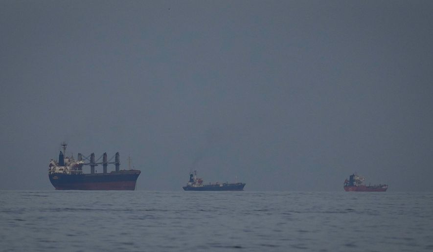 Oil tankers and ships line up in the Strait of Hormuz as seen from Khor Fakkan, United Arab Emirates, Wednesday, March 11, 2026. (AP Photo/Altaf Qadri)