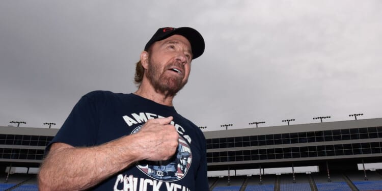 Actor Chuck Norris reacts prior to the NASCAR Sprint Cup Series AAA Texas 500 at Texas Motor Speedway on Nov. 6, 2016, in Fort Worth, Texas.