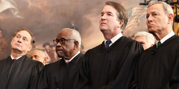 Associate Supreme Court Justices Samuel Alito, Clarence Thomas, and Brett Kavanaugh, as well as U.S. Chief Justice John Roberts, look on during inauguration ceremonies in the Rotunda of the U.S. Capitol on Jan. 20, 2025, in Washington, D.C.