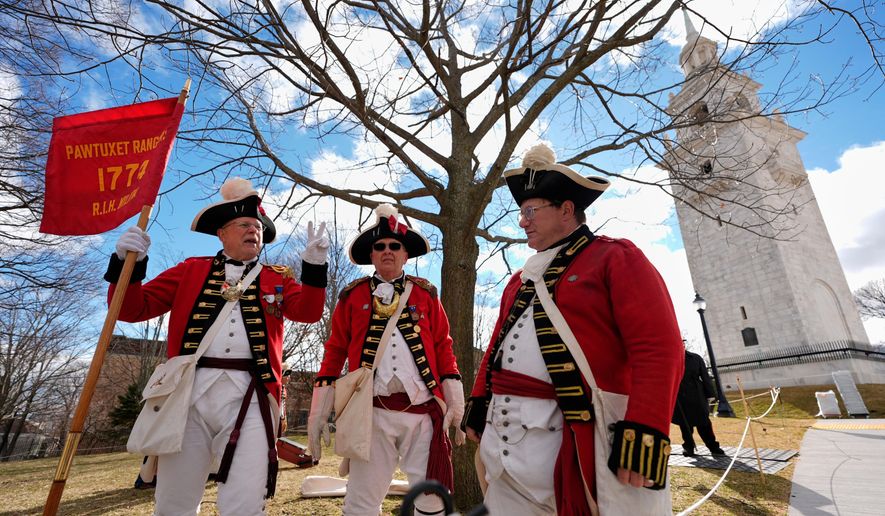 Pawtucket Rangers Militia reenactors assemble in an Evacuation Day ceremony marking the 1776 departure of British troops from the city during the American Revolutionary War, Tuesday, March 17, 2026, in Boston. (AP Photo/Robert F. Bukaty)