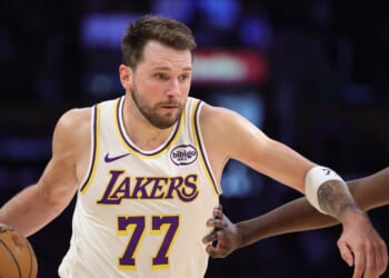 Luka Doncic of the Los Angeles Lakers controls the ball against the New York Knicks in the first half at Crypto.com Arena on March 8, 2026, in Los Angeles, California.