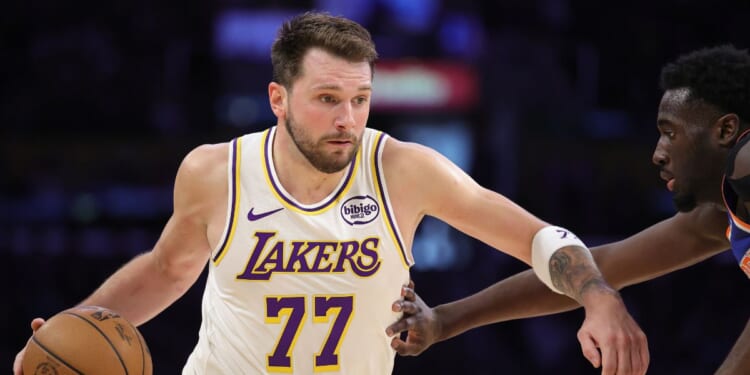 Luka Doncic of the Los Angeles Lakers controls the ball against the New York Knicks in the first half at Crypto.com Arena on March 8, 2026, in Los Angeles, California.