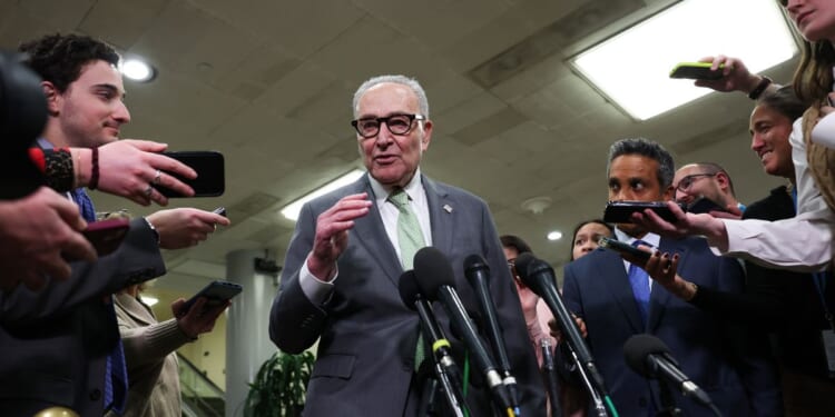 Senate Minority Leader Chuck Schumer speaks to the media while attending congressional briefings on Iran at the U.S. Capitol on March 3, 2026, in Washington, D.C.