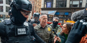 U.S. Border Patrol commander Gregory Bovino pushes through a crowd of media and protesters as he enters the Dirksen Federal Building on Oct. 28 in Chicago, Illinois, to meet with U.S. District Judge Sara Ellis. A federal appeals court last week ruled against what it called Ellis' "sweeping preliminary injunction" that attempted to regulate "all federal immigration enforcement efforts districtwide."