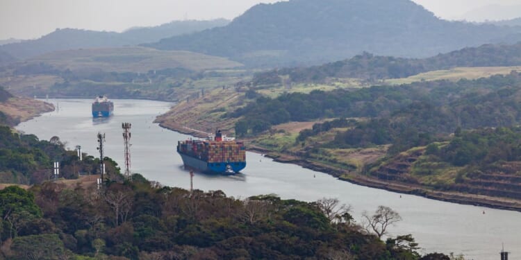 Cargo ships travel through the Panama Canal on March 26, 2019.