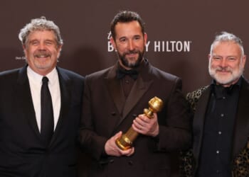 Producer John Wells, actor Noah Wyle, and producer R. Scott Gemmill, winners of the Best Television Series - Drama Award for "The Pitt", pose in the press room during the 83rd annual Golden Globe Awards at the Beverly Hilton hotel in Beverly Hills, California, on Jan. 11, 2026.