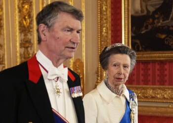 Vice Admiral Sir Tim Laurence and Princess Anne, sister of King Charles III, attend the state banquet for President of Nigeria Bola Ahmed Tinubu and First Lady Oluremi Tinubu at Windsor Castle, Berkshire, on Wednesday in Windsor, England. Anne wore a white ensemble that she first wore in public in 1969.