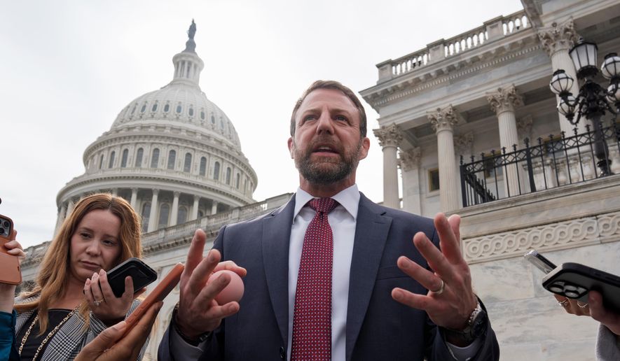 Sen. Markwayne Mullin, R-Okla., speaks with reporters on the steps at the Capitol in Washington, Thursday, March 5, 2026. (AP Photo/J. Scott Applewhite)