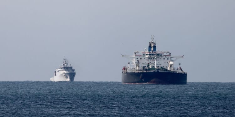 The Mozambican-flagged oil tanker "Deyna," suspected of belonging to the Russian's shadow fleet, is seen outside the coast of Martigues near the port of Marseille-Fos on Mars 23, 2026, as it's surveilled by the French Navy.