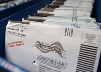 Mail-in ballots sit in trays at the Santa Clara County registrar of voters office in a file photo from Oct. 13, 2020, in San Jose, California.