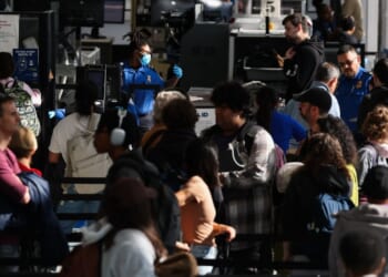 Passengers wait in line for a Transportation Security Administration security checkpoint at Los Angeles International Airport in Los Angeles on Nov. 26, 2025.