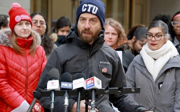 Chicago Teachers Union Vice President Jackson Potter speaks to news media at rally on February 26, 2026.