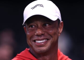 Tiger Woods smiles at a golf match at SoFi Center in Palm Beach Gardens, Florida, on March 23, 2026.