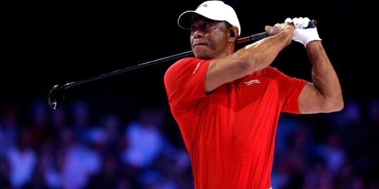 Tiger Woods plays a shot on the ninth hole at SoFi Center on Tuesday in Palm Beach Gardens, Florida. Woods was reportedly involved in a rollover car accident Friday on Jupiter Island, Florida.