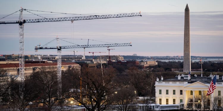 Cranes mark the D.C. skyline as part of construction on the new ballroom extension of the White House in January.